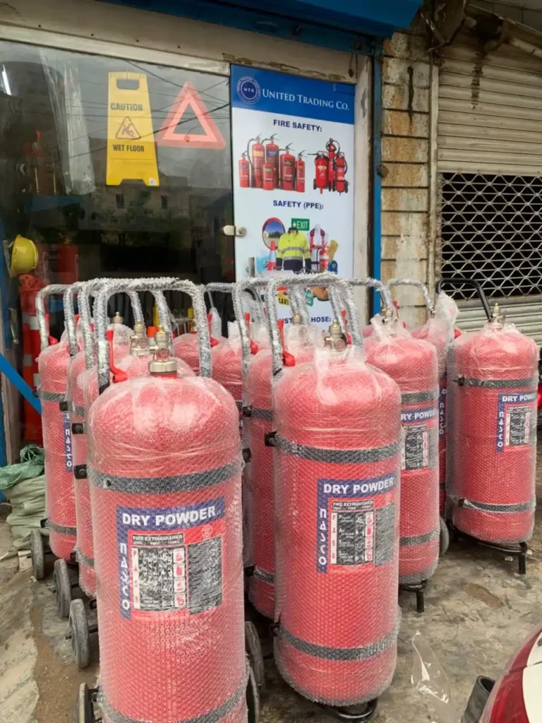 United Trading Company shop front in Karachi, with trolley dry powder fire extinguishers outside the door
